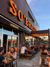 Outdoor restaurant patio with illuminated marquee sign