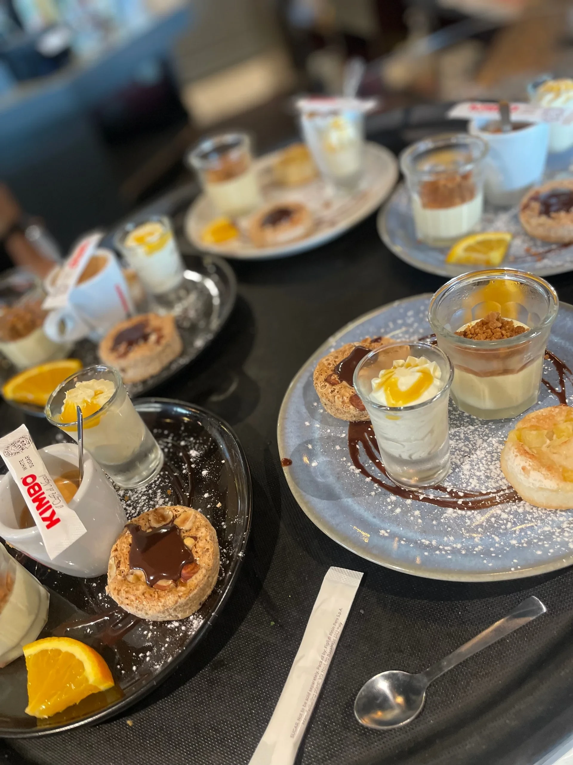 Assorted desserts and coffee on café table